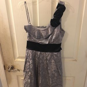 A one shoulder party dress.